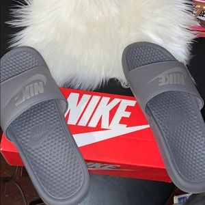 Grey Nike slides